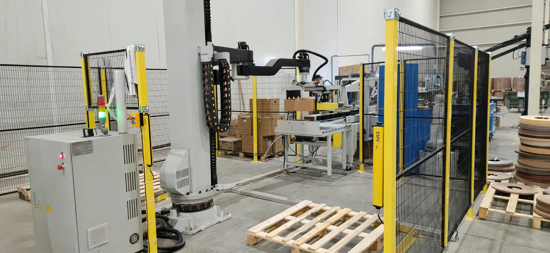 Robotic packaging arm handling a pallet at Tece Dekor Bulgaria's Burgas facility